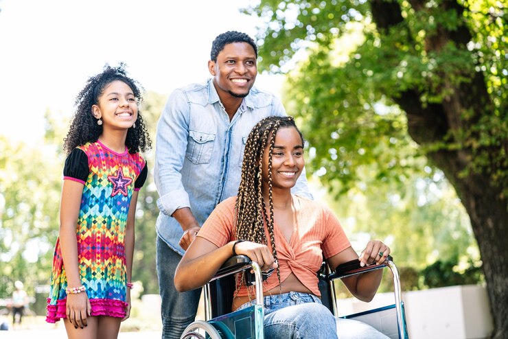 african-american-woman-wheelchair-enjoying-walk-outdoors-with-her-daughter-husband_58466-16141